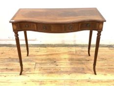 A Regency style inlaid mahogany console table of serpentine outline, the cross banded top with