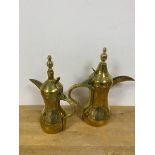 Two brass Arabic coffee pots (larger: 32cm)