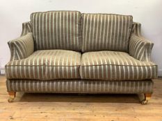 Wade Upholstery, A contemporary 'Kempston' two seat sofa, upholstered in a teal and brown stripped