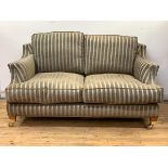 Wade Upholstery, A contemporary 'Kempston' two seat sofa, upholstered in a teal and brown stripped