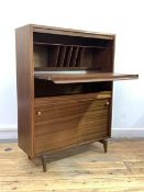 A Vintage mid century teak bureau, the fall front revealing writing surface and correspondence