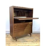 A Vintage mid century teak bureau, the fall front revealing writing surface and correspondence