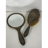 An Edwardian Birmingham silver hand mirror and brush (hand mirror: 26cm x 14cm) (2)