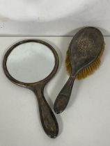 An Edwardian Birmingham silver hand mirror and brush (hand mirror: 26cm x 14cm) (2)