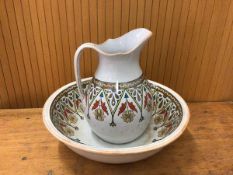 A 19thc wash basin marked DAISY to base measures 12x39cm with matching jug