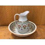 A 19thc wash basin marked DAISY to base measures 12x39cm with matching jug