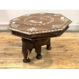 An Indian hardwood lamp table, the octagonal top with bone inlay depicting elephants and foliate,