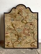 An early 20th century embroidered panel, in an arched frame with textile to reverse, 53cm x 69cm