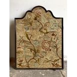 An early 20th century embroidered panel, in an arched frame with textile to reverse, 53cm x 69cm