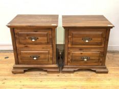 A Pair of hardwood bedside chests, each fitted with two drawers, raised on shaped block supports,