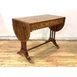 A figured walnut and yew wood sofa table of Regency design, the cross banded top with two drop