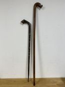 A South Pacific walking stick with stylised fish carving to handle (104cm) and a South East Asian