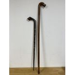 A South Pacific walking stick with stylised fish carving to handle (104cm) and a South East Asian