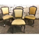 A set of four French Louis XV style dining chairs, having floral carved painted frames,