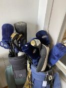 A collection of golf clubs including woods such as a Hippo Beast Driver, Arizona Golf Co. three