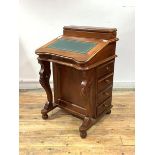 A Victorian style mahogany davenport, with stationary casket and tooled writing slope lifting to