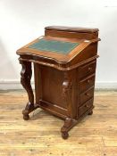 A Victorian style mahogany davenport, with stationary casket and tooled writing slope lifting to