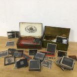 A collection of glass slides including holiday pictures, portraits, religious slides, also