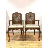 A Pair of Anglo-Indian hardwood carver chairs, with floral carved backs peirced and in relief,