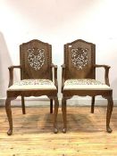 A Pair of Anglo-Indian hardwood carver chairs, with floral carved backs peirced and in relief,