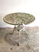 A floral cast aluminum garden table, the circular top raised on triple splay supports united by