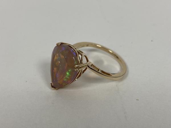 A 9ct gold pear shaped cut opal in pierced setting and shank to shoulders (O) (3.17g)