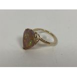 A 9ct gold pear shaped cut opal in pierced setting and shank to shoulders (O) (3.17g)