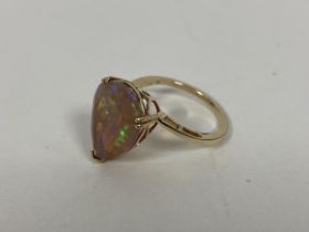 A 9ct gold pear shaped cut opal in pierced setting and shank to shoulders (O) (3.17g)