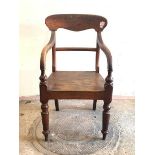 A Scottish Victorian mahogany elbow chair, the shaped crest rail over bar back, down swept arms