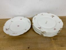 A set of six Limoges plates, with rose and gilt decoration (each: 22cm), stamped to base Limoges