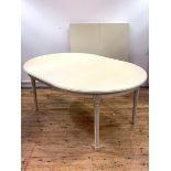 A cream painted Gustavian style extending dining table, the oval top with three leaves, raised on
