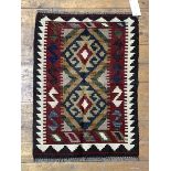 A Maimana Kilim rug, with double lozenge medallion within running dog border, 84cm x 61cm