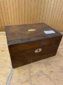 A 19thc rosewood box with mother of pearl plaque and escutcheon measures 13x25x17cm