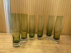 A group of six glass vases in shades of green of tulip form with etching decoration including birds,