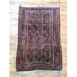 A Baluchi rug, with a lineal geometric design and guard stripes to border, 111cm x 72cm