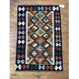 A Chobi Kilim rug, the field with lozenge motif framed within a geometric border 122cm x 82cm