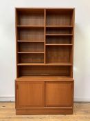 Hundevad, A Danish mid century bookcase on cupboard, the top fitted with six adjustable shelves,