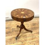 A Regency style yew wood drum table, the circular top with segmented veneers centred by a boxwood
