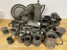 A large quantity of 19thc and later pewter, including coffee pot (33cm), mugs, measures, plates,