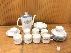 A Royal Doulton pastorale coffee set with coffee pot measuring 21cm high, seven coffee cups and