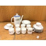 A Royal Doulton pastorale coffee set with coffee pot measuring 21cm high, seven coffee cups and