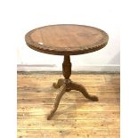 An Anglo-Indian hardwood occasional table, the circular top with relief carved interlaced foliate