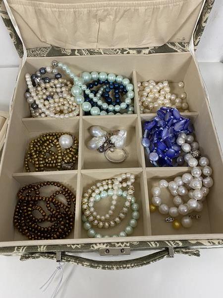 A quantity of faux and cultured pearls, mostly necklaces and bracelets but includes earrings,