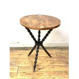 A gypsy table, the circular yew wood top on a bobbin turned ebonised base, H68cm, D52cm