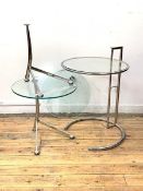 A post modern lamp table, with circular plate glass top on a rise and fall chrome base, (H76cm,