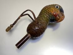 A novelty painted carved wooden umbrella handle, modelled as a parrot's head. Overall 17cm