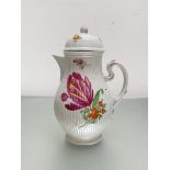 A French porcelain coffee pot in 18th century style, of baluster form, with reeded bands and painted