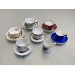 A group of Meissen and other cups and saucers, 19th century comprising: a teacup and saucer