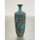 A signed Japanese cloisonne vase decorated with weeping cherry blossom, iris and other flowers