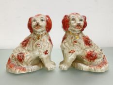 A pair of large Staffordshire models of seated spaniels, each with gilt chain and collar. Height